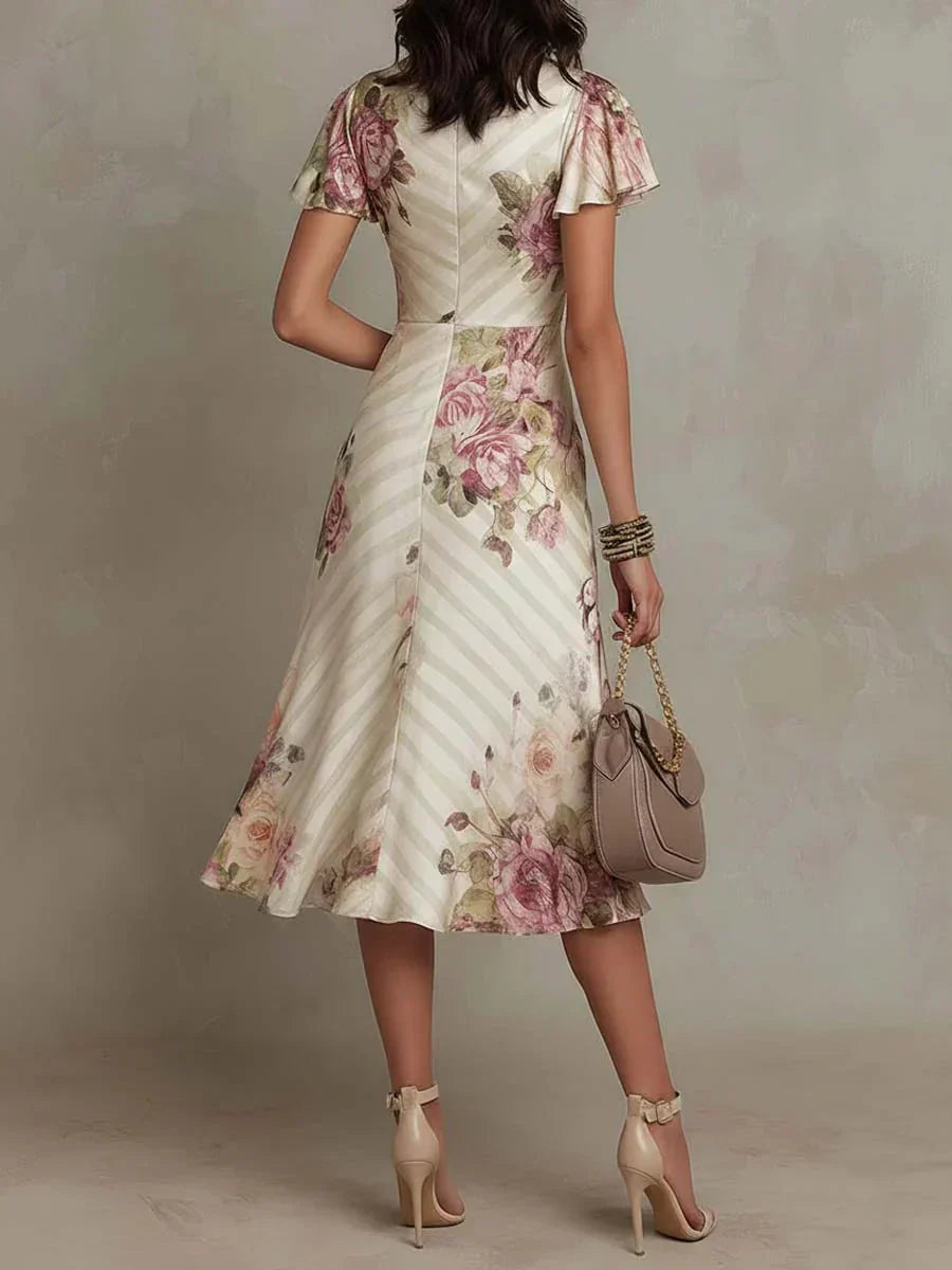 Alba | Elegante vestido midi cruzado con estampado floral y fruncido