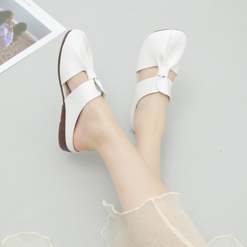 Elegantes mules planas con nudo