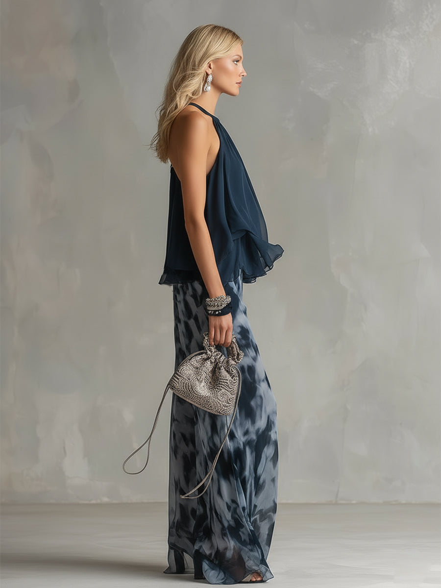 Martina | Elegante conjunto con top halter azul marino y pantalones anchos estampados.