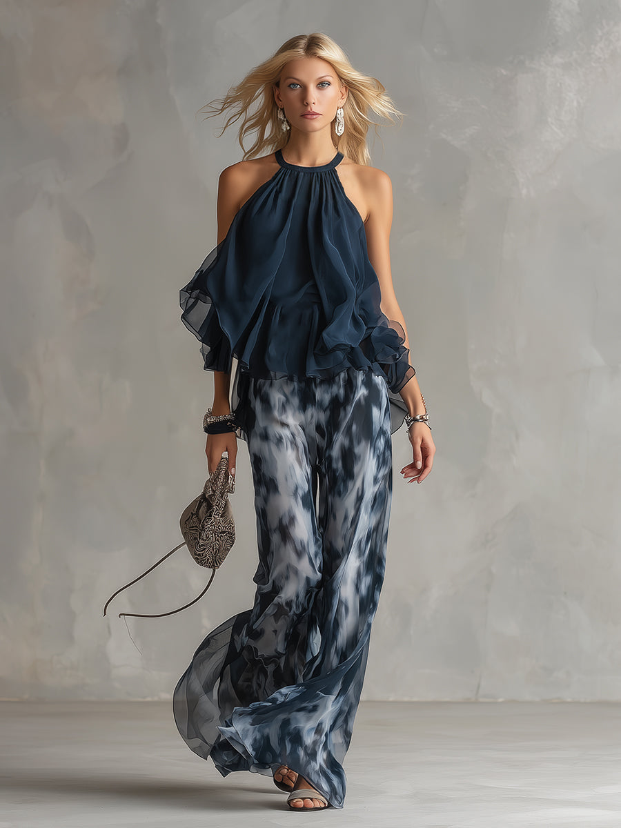 Martina | Elegante conjunto con top halter azul marino y pantalones anchos estampados.