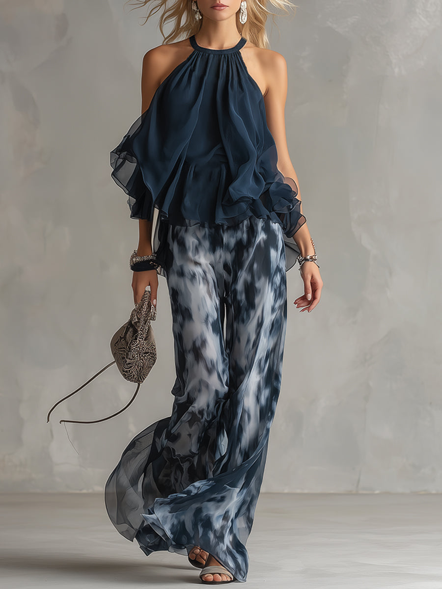 Martina | Elegante conjunto con top halter azul marino y pantalones anchos estampados.