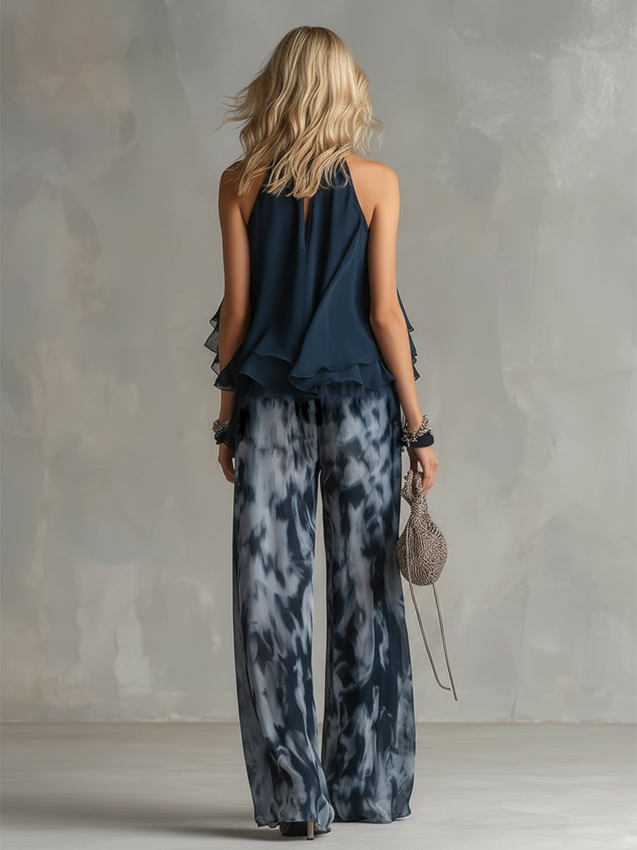 Martina | Elegante conjunto con top halter azul marino y pantalones anchos estampados.