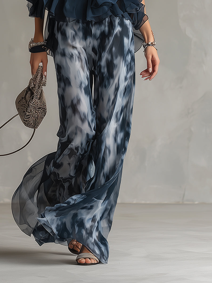 Martina | Elegante conjunto con top halter azul marino y pantalones anchos estampados.