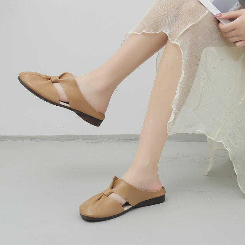 Elegantes mules planas con nudo