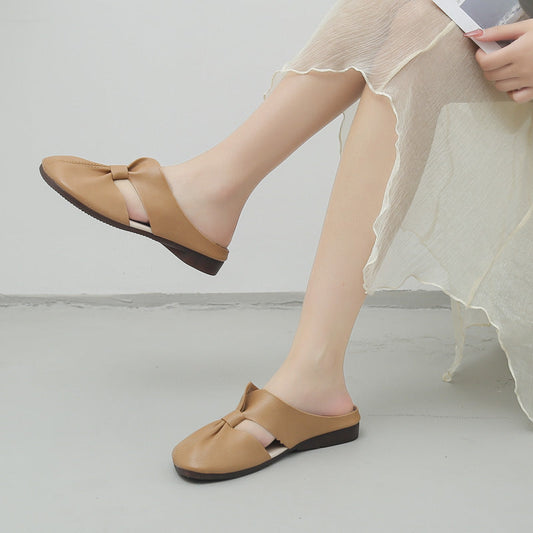 Elegantes mules planas con nudo